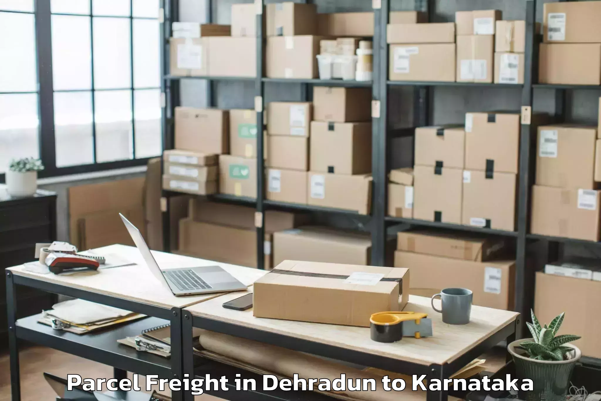 Book Dehradun to Rani Channamma University Bela Parcel Freight Online